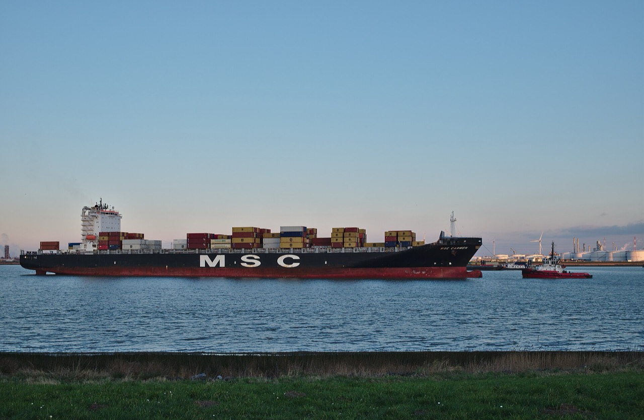Container ship under tow approaching port