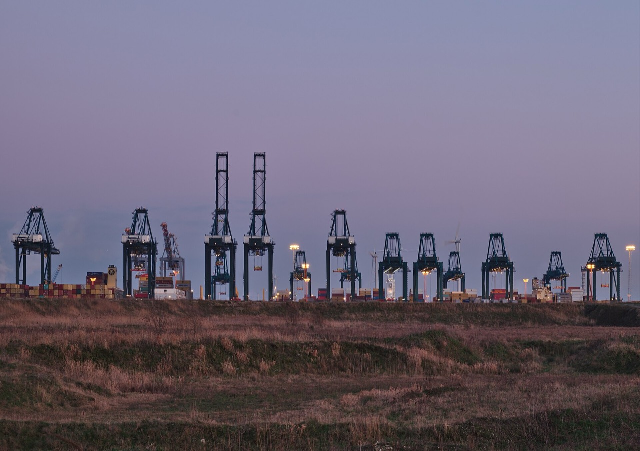 Container cranes at a port terminal at dusk